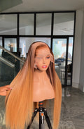Honey brown with dark roots.